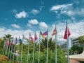 Flags of different countries on flagpoles against a blue sky in Turkey Royalty Free Stock Photo