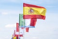 Flags of different countries flutters in wind against Royalty Free Stock Photo