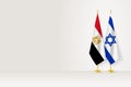 Flags of Egypt and Israel on flag stand, meeting between two countries