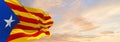 flags of Estelada blava waving in the wind on flagpoles against sky with sunset clouds on sunny day. Symbolizing patriotism. 3d Royalty Free Stock Photo