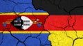 Flags of Eswatini and Germany on cracked surface