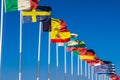 Flags of EU countries on a white flagpole Royalty Free Stock Photo