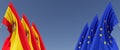 Flags of EU and Spanish on flagpoles on sides. Flags on a blue background. Place for text. European Union. Spain flag. Madrid.