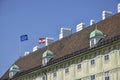Flags of the European Union and Austria on the roof of the medieval building of the winter residence of the Austrian imperial