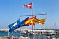Flags of the European Union, Spain, Catalonia and others on the masts of yachts. Royalty Free Stock Photo
