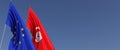 Flags of the European Union and Tunisia on flagpoles on sides. Flags on a blue background. Place for text. EU. Tunisian. 3d