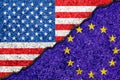 Flags of European Union and USA painted on cracked wall background/European Union versus USA conflict concept Royalty Free Stock Photo