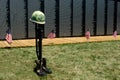 Flags and fallen soldier symbol at the wall