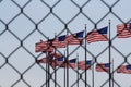 Flags through a fence symbolism