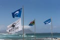 Flags flying over a South African beach Royalty Free Stock Photo