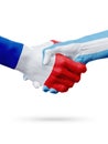 Flags France, Argentina countries, partnership friendship handshake concept.