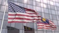 Flags of the United States and Malaysia in front of a modern skyscraper facade. 3D rendering