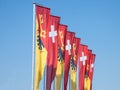 Flags of Geneva and Switzerland waiving in the wind in Geneva, one of the economyc and financial hubs of the country Royalty Free Stock Photo