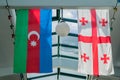 Flags of Georgia and Azerbaijan hanging on the ceiling Royalty Free Stock Photo