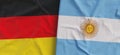 Flags of Germany and Argentina. Linen flag close-up. Flag made of canvas. German, Berlin. Benos Aires. State national symbols. 3d