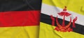 Flags of Germany and Brunei. Linen flag close-up. Flag made of canvas. German, Berlin. Brunei Darussalam. State national symbols.