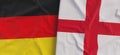 Flags of Germany and England. Linen flag close-up. Flag made of canvas. German, Berlin. English. State national symbols. 3d