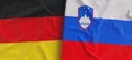 Flags of Germany and Slovenia. Linen flag close-up. Flag made of canvas. German, Berlin. Lublyana State national symbols. 3d