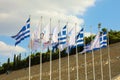 Flags of Greece and flags of Olympic games wave outside of Panathenaic Stadium in Athens, Greece on July 18, 2018 Royalty Free Stock Photo