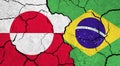 Flags of Greenland and Brazil on cracked surface
