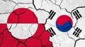 Flags of Greenland and South Korea on cracked surface