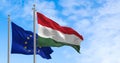 The flags of Hungary and the European Union fluttering together on a clear day Royalty Free Stock Photo