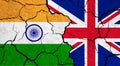 Flags of India and United Kingdom on cracked surface