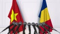 Flags of Vietnam and Romania at international meeting or negotiations press conference. 3D rendering Royalty Free Stock Photo