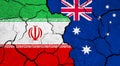 Flags of Iran and Australia on cracked surface