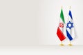 Flags of Iran and Israel on flag stand, meeting between two countries