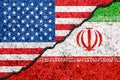 Flags Of Iran And USA Painted On Cracked Wall Background/Iran Versus USA Conflict Concept