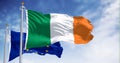 The flags of Ireland and the European Union fluttering together on a clear day Royalty Free Stock Photo