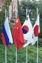 Flags of Japan, Russia, China, Republic of Korea on the flagpoles