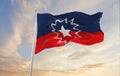 flags of Juneteenth waving in the wind on flagpoles against sky with sunset clouds on sunny day. Remember our ancestors, slavery