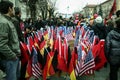 Flags of Kosovo waiving next to USA American and German and Albanian flags in a crowd in streets of Prishtina to celebrate