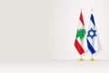 Flags of Lebanon and Israel on flag stand, meeting between two countries