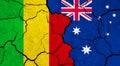 Flags of Mali and Australia on cracked surface