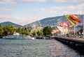 Flags on the Mont Blanc bridge, tour boat and ferris wheel in Geneva Royalty Free Stock Photo