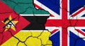 Flags of Mozambique and United Kingdom on cracked surface