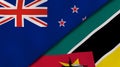 The flags of New Zealand and Mozambique. News, reportage, business background. 3d illustration