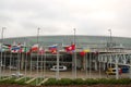 Flags on the poles, Shuttles and Police car at Chicago O\'Hare International Airport Terminal 5 in Chicago, IL, USA