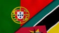 The flags of Portugal and Mozambique. News, reportage, business background. 3d illustration