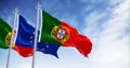 flags of Portugal waving with European Union flag on a clear day