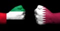Flags of Qatar and Saudi Arabia painted on two clenched fists fa