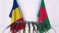 Flags of Romania and Bangladesh at international meeting or negotiations press conference. 3D rendering Royalty Free Stock Photo