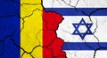 Flags of Romania and Israel on cracked surface