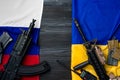 Flags of Russia and Ukraine with weapon rifles