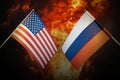 Flags of Russia and United States of america against background of a fiery explosion. The concept of enmity and war