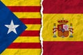 Flags of spain and catalonia on torn paper texture