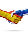 Flags Spain, Finland countries, partnership friendship handshake concept.